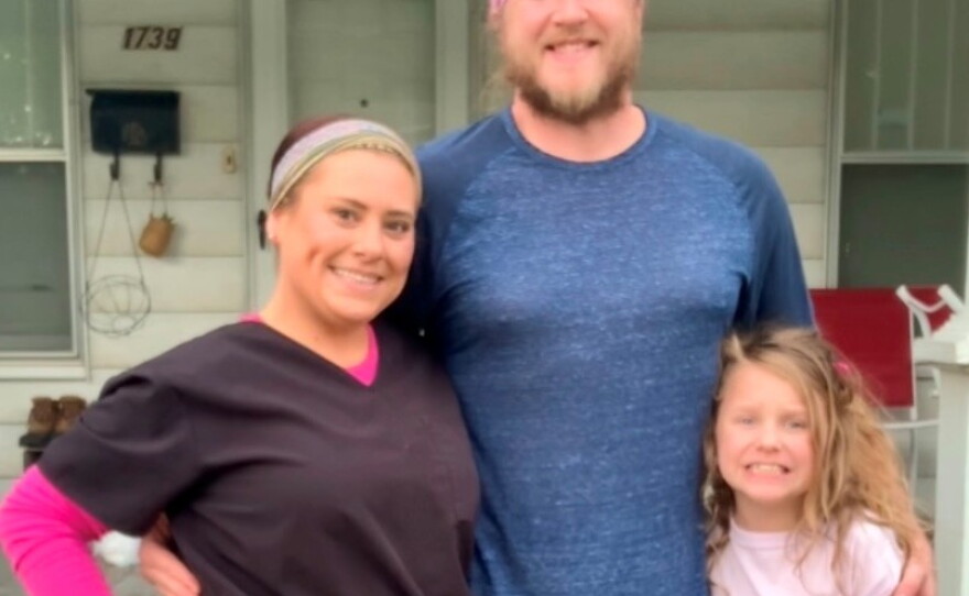 Raelynn McMurchy, left, with her husband Tucker and daughter Ella, launched an online petition over high power bills. Her last bill topped $1,370, including a $598 deposit following previous late payments.