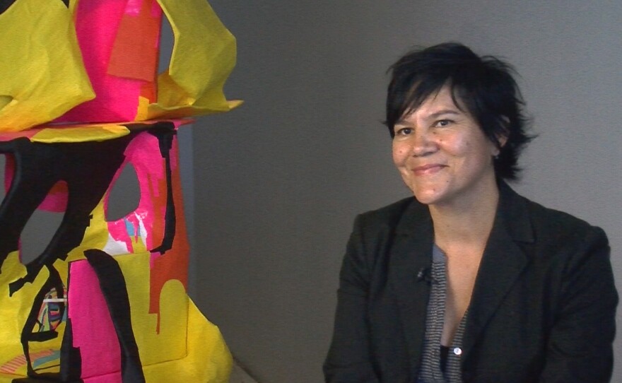 Rochelle Botello sits next to her installation piece, "Corpse Flower," at Punto Experimental in the Barrio Logan Art District, May 9, 2015.