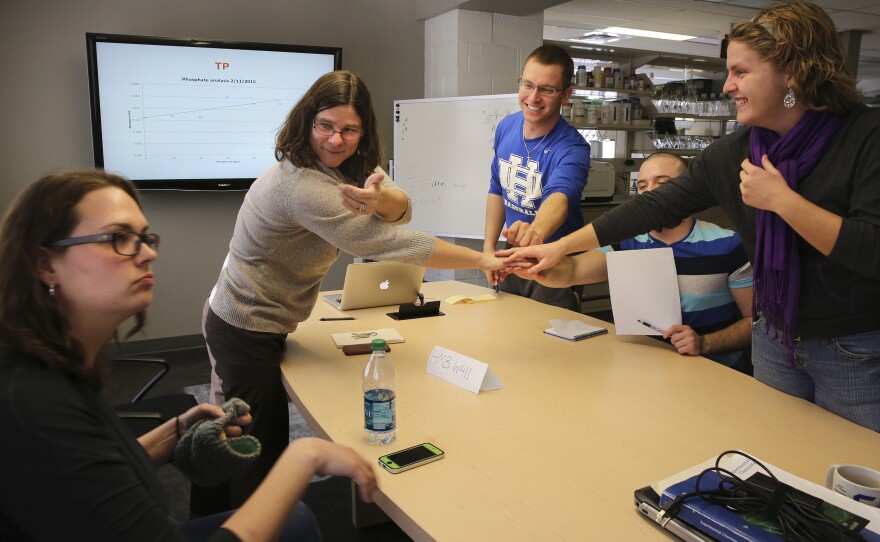 Solomon ends her biology lab with all hands in.