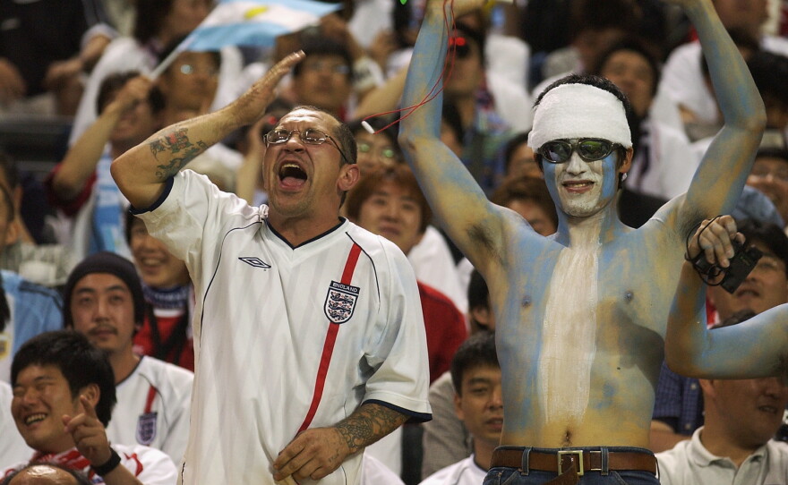 England and Argentina fans sit side by side during the FIFA World Cup match in Sapporo, Japan, on June 7, 2002. England won 1-0. The old rivals meet again this year in a World Cup semifinal showdown.
