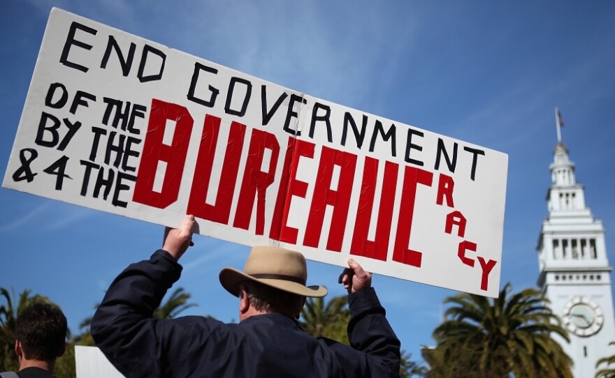 <p>An activist holds a sign during a tax day Tea Party rally in San Francisco.</p>