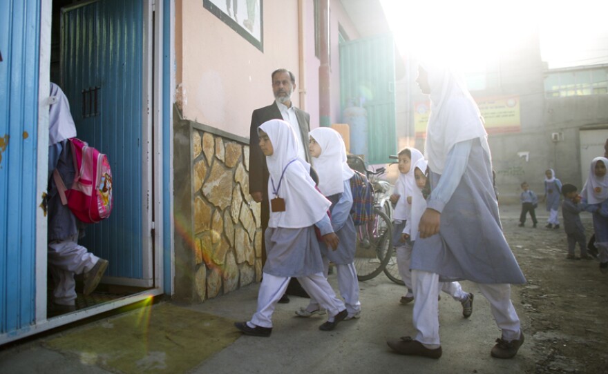This is something you never would have seen under the Taliban: Girls walking to school.