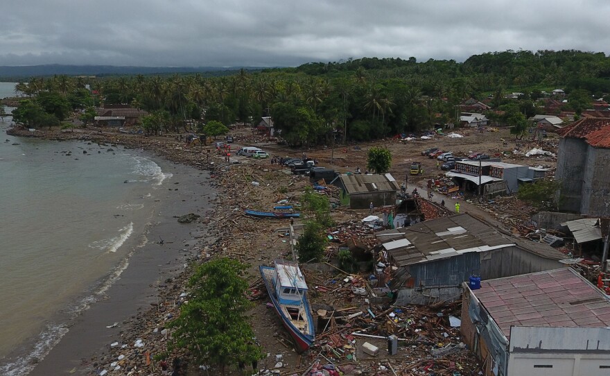 Damaged houses, boats and debris are seen after a tsunami in this aerial photo taken in Sumur, Pandeglang, Banten province, Indonesia, on Tuesday. The death toll from a tsunami now exceeds 400.
