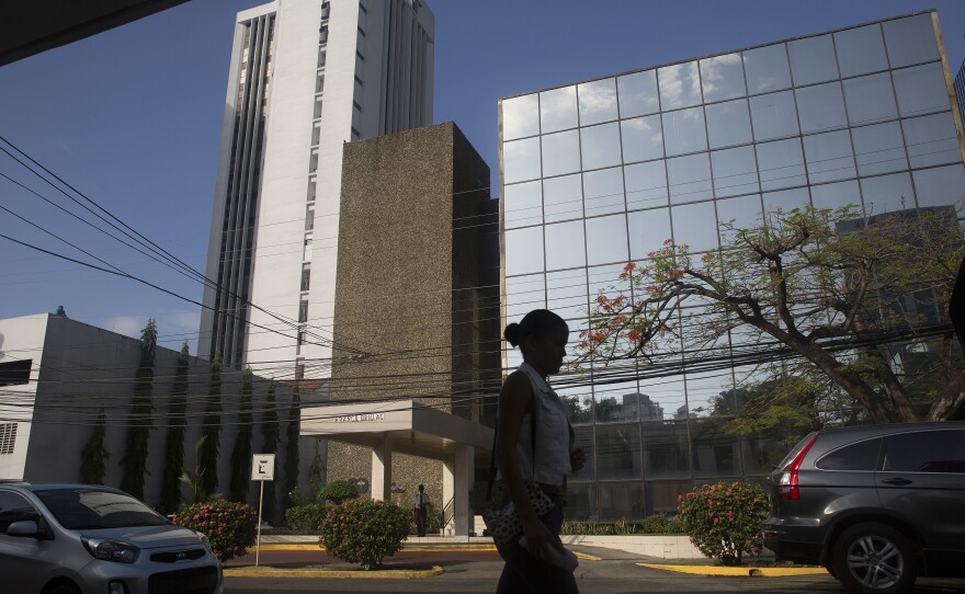 A pedestrian walks past the building housing the offices of Mossack Fonseca in Panama City, Panama, on Tuesday. The massive trove of emails, contracts and other papers from the law firm is being called the largest document leak in history.