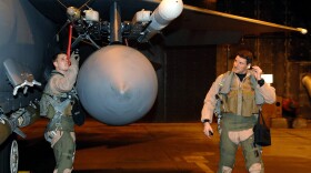 (EDITORS NOTE: Image has been reviewed by U.S. Military prior to transmission.) In this handout image provided by the U.S. Air Force, Maj. Lucas Teel, 492nd Fighter Squadron pilot, and Lt. Col. Clint Mixon, 492nd FS commander, perform preflight checks on an F-15E Strike Eagle prior to their departure from RAF Lakenheath in preparation for Operation Odyssey Dawn missions March 19, 2011 in Lakenheath, United, Kingdom. 