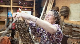 MaddyChristine Hope Brokopp weaves the bottom of a burial tray. Brokopp enlisted her friends to weave her tray after a cancer diagnosis.