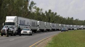 A convoy of Walmart trucks waited to enter New Orleans on Sept. 1, 2005, after the city was battered by Hurricane Katrina. Government agencies said the massive storm taught them that big-box retailers need to be an integral part of hurricane preparation and relief efforts.
