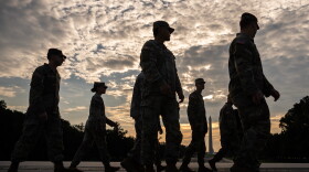 Members of the National Guard walk past the Lincoln Memorial Reflecting Pool before the March on Washington, Friday, Aug. 28, 2026, in Washington.