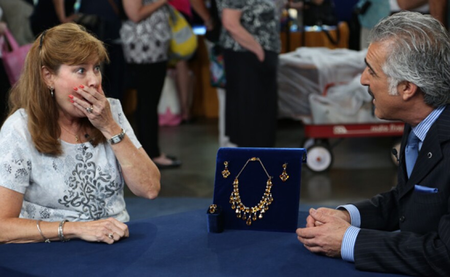 Kevin Zavian (right) appraises a citrine and white sapphire set, ca. 1940, for $3,000 to $4,000 in Detroit, Michigan.