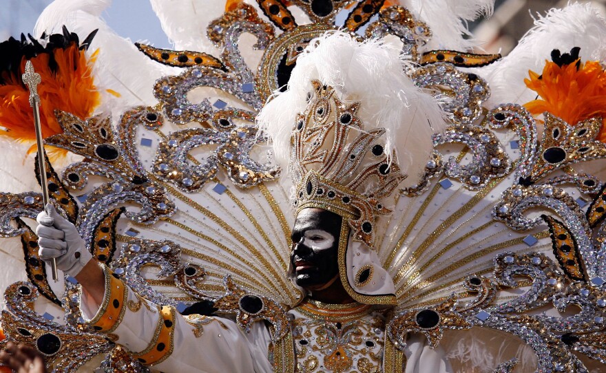 King Zulu waves to the crowds from his float on Mardi Gras day on Feb. 24, 2009 in New Orleans. The Zulu Social Aid & Pleasure Club is facing criticism for its tradition of wearing black face makeup during Mardi Gras.