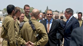 U.S. Defense Secretary Leon E. Panetta and Israeli Defense Minister Ehud Barak speak with Israeli soliders at an Iron Dome anti-missile site in Ashkelon, Israel, Aug. 1, 2012. 