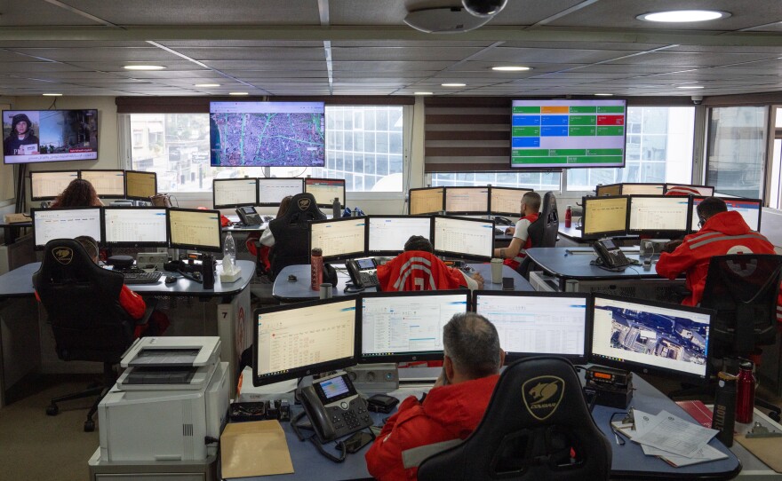 People work at the Red Cross dispatch center in southern Beirut.