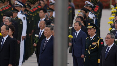 Chinese President Xi Jinping, center left and Zhang Shengmin, Vice Chairman of the Central Military Commission second from right attend a ceremony in honor of fallen national heroes at the Monument to the People's Heroes to mark Martyrs' Day at Tiananmen Square in Beijing, Wednesday, Sept. 30, 2026.