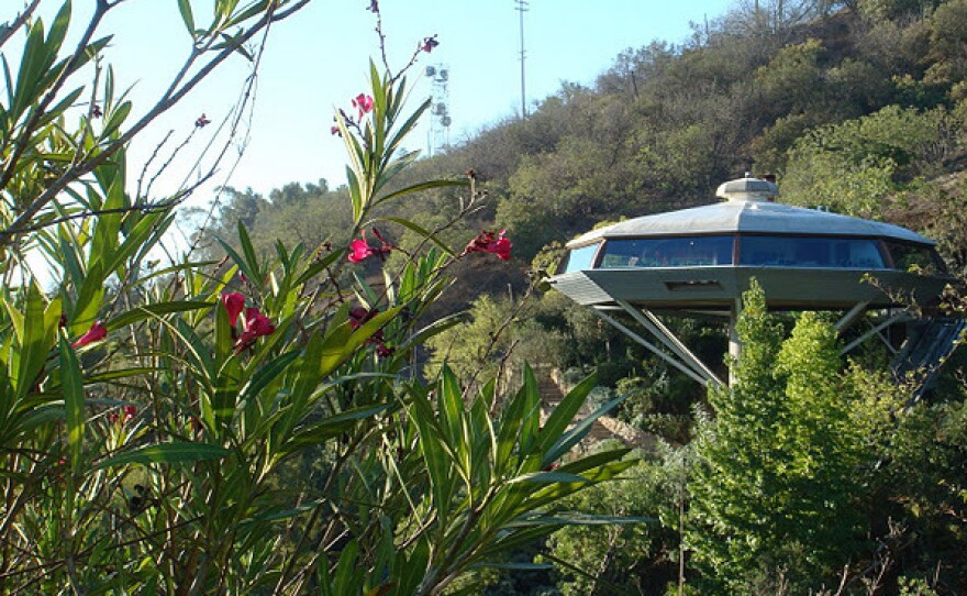 Designed in 1958, architect John Lautner's Chemosphere House perches atop a 29-foot concrete pole on a roughly 45 degree slope in California's Hollywood Hills and is accessible via funicular.