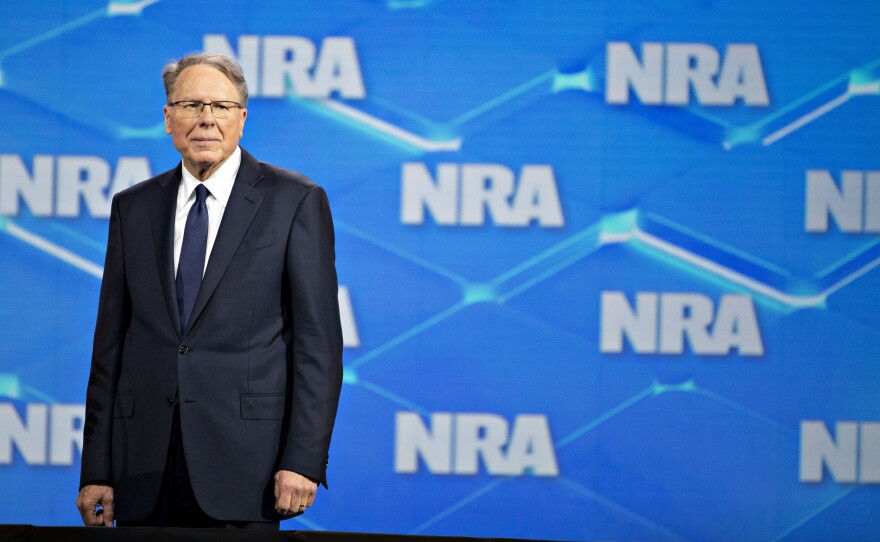 Wayne LaPierre, CEO of the National Rifle Association, stands onstage during the NRA's annual meeting in Indianapolis on April 26, 2019.