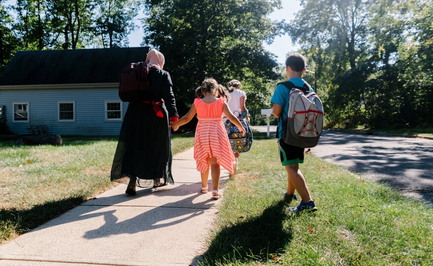 The family heads home after everyone is off the bus.