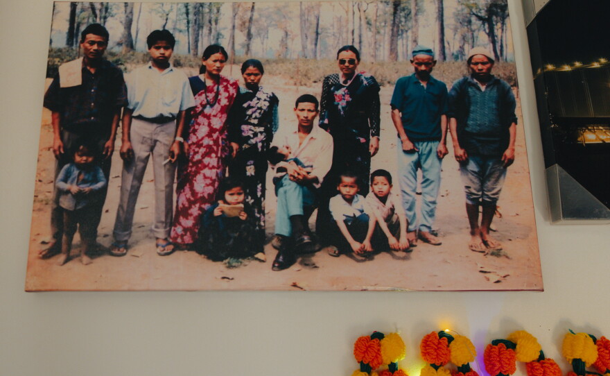 Manju Gurung's family keeps a portrait from their time in the camps, as seen in their home amid holiday festivities in honor of Tihar, the Hindu festival of lights and animals, in Mount Holly Springs, Pa., on Oct. 23, 2025.