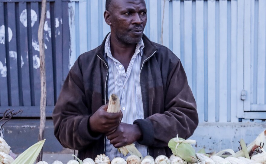 Stanley Ngugi buys supplies of maize to sell in Kibera. During the pandemic, his income dried up. "There were many of us who slept hungry and with zero support from the government then," he recalls.