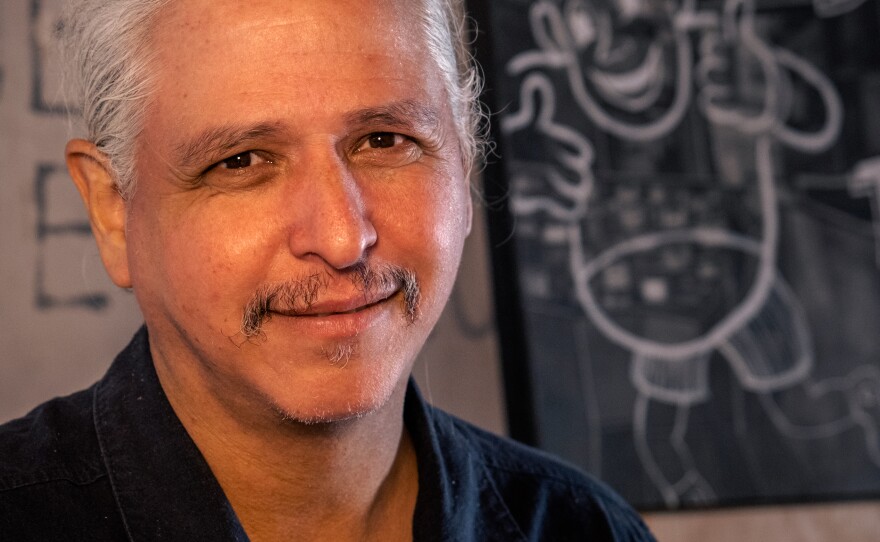 Artist Hugo Crosthwaite is shown in his Rosarito studio in an undated photo. His stop-motion animated portrait of Dr. Anthony Fauci was included in a White House post titled "President Trump is eight about the Smithsonian."