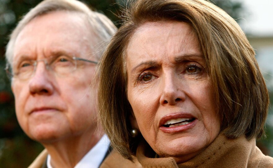U.S. Speaker of the House Rep. Nancy Pelosi (D-CA) speaks to the media as Senate Majority Leader Sen. Harry Reid (D-NV)  listens after a meeting with President Barack Obama, December 9, 2009 at the White House in Washington, D.C.