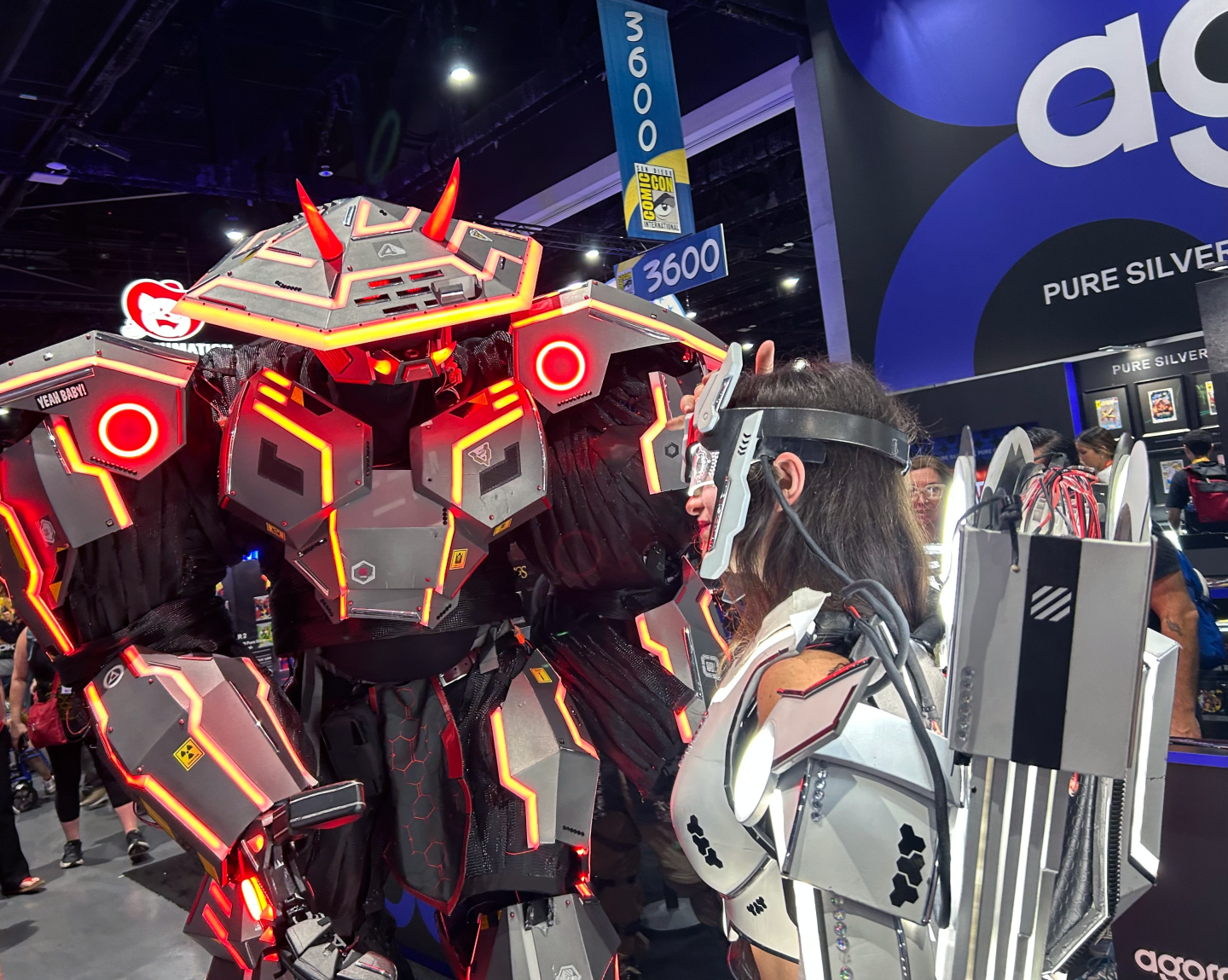 Cosplayers in illuminated mecha samurai suits at Comic-Con on July 23, 2026.