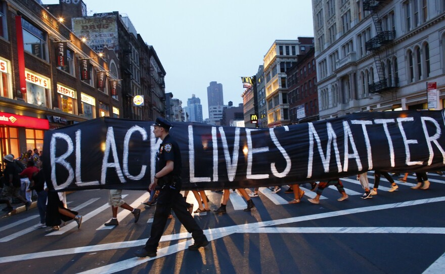 A police officer patrols during a protest in support of the Black Lives Matter movement in New York City on July 9.