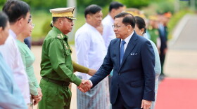 In this photo released by Myanmar President Office, Myanmar President Min Aung Hlaing, right, shakes hands with Commander-in-Chief Gen. Ye Win Oo, left, upon his departure to Vietnam, at the Naypyitaw international airport Friday, Sept. 4, 2026, in Naypyitaw, Myanmar.