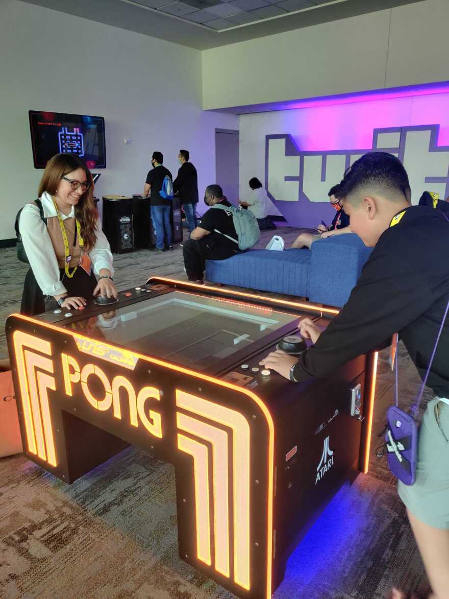 TwitchCon attendees take a break from the convention to play Pong, a classic Atari game, Oct. 9, 2022.