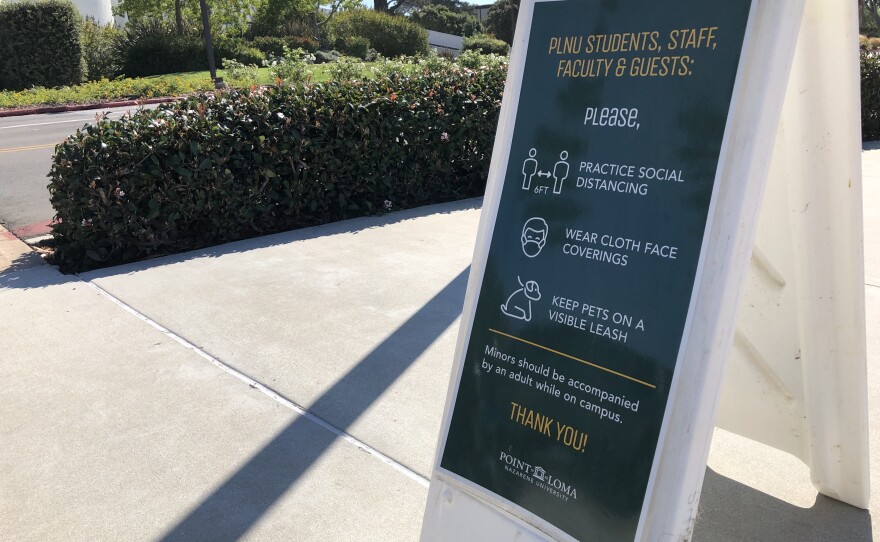 A sign reminding people of COVID safety measures is shown on the campus of Point Loma Nazarene University on Oct. 14, 2020.