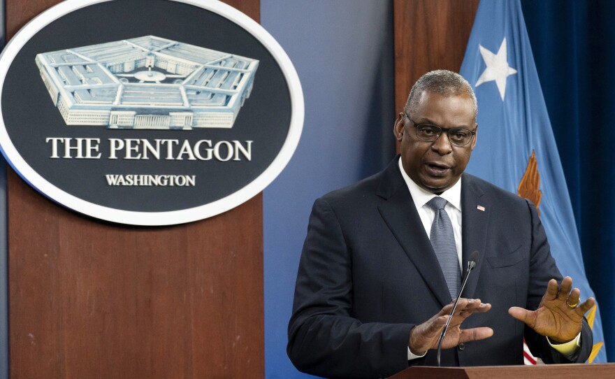 Secretary of Defense Lloyd Austin speaks during a media briefing at the Pentagon last month. The military branches have begun discharging people who refuse to get vaccinated against COVID-19.