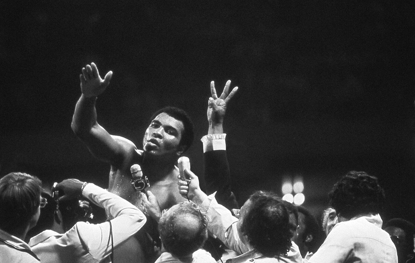 Muhammad Ali talks with the press after winning back the Heavyweight Championship for an unprecedented third time by beating Leon Spinks at the Super Dome in New Orleans, La. Sept. 15, 1978.