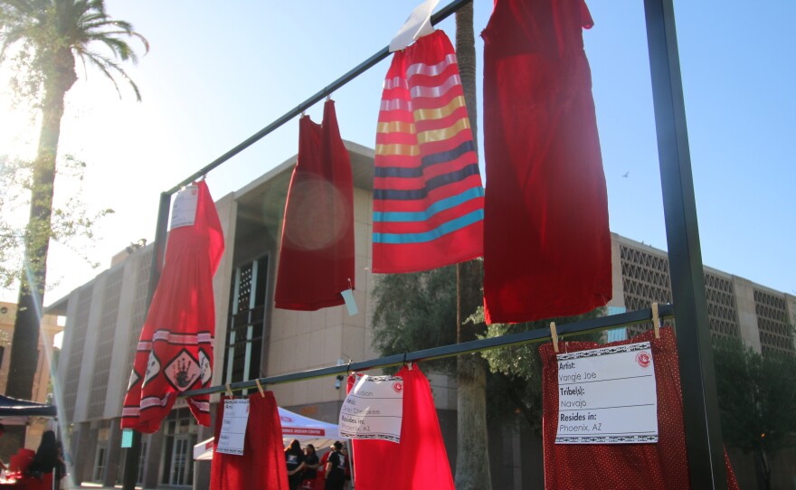 Red skirts are on display at the Arizona State Capitol in Phoenix, Wednesday, May 5, 2021, to raise awareness for missing and murdered Indigenous women and girls. Phoenix Indian Center Executive Director Patricia Hibbeler said the skirts are a huge part of the lives of Native American women and girls.