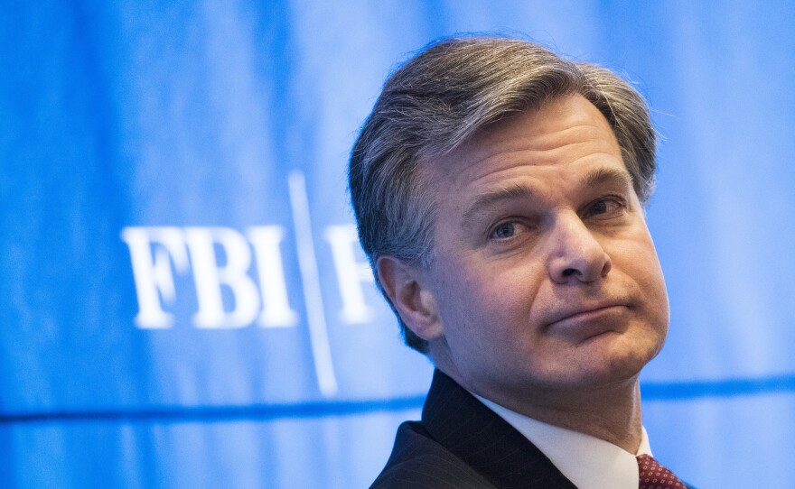 FBI Director Christopher Wray attends the International Conference on Cyber Security on Jan. 9. The FBI says that someone called its tip line to report concerns about Nikolas Cruz, who has told police he killed 17 people in Parkland, Fla. The bureau failed to follow protocols to assess the threat.