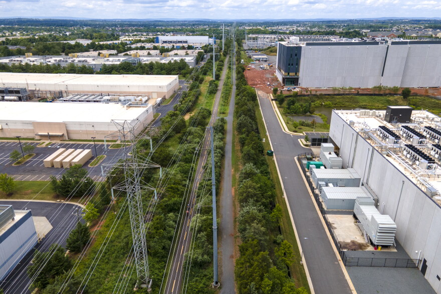 High-voltage transmission lines provide electricity to data centers in Ashburn, Virginia. Globally, data centers' demand for electricity is expected to roughly double by 2030.