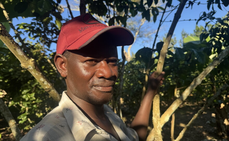 Goldiano Kiganda, the son of Uganda's first reported HIV patient, stands at his father's grave in Kasensero. The town of 15,000 was one of the lenacapavir clinical trial sites. During the rollout, the town received 60 doses of the drug.