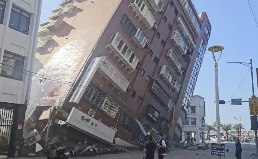 In this image taken from a video footage run by TVBS, a partially collapsed building is seen in Hualien, eastern Taiwan on Wednesday, April 3, 2024. A powerful earthquake rocked the entire island of Taiwan early Wednesday, collapsing buildings in a southern city and creating a tsunami that washed ashore on southern Japanese islands.