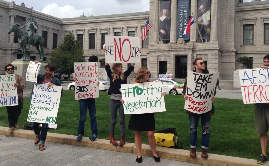 Led by Max Geller, protesters rally outside of the Boston Museum of Fine Art.