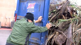 City Heights residents clear debris out of Fox Canyon in San Diego, April 26, 2014.