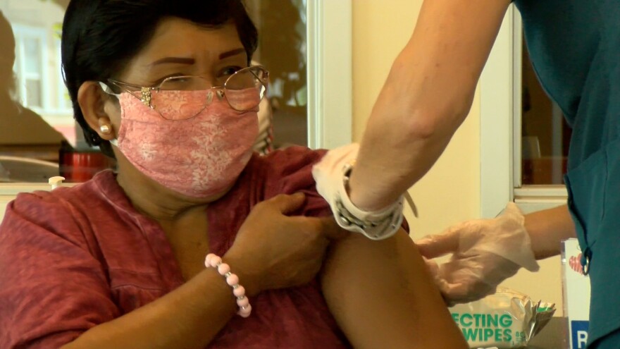 A San Diego County resident getting a COVID-19 booster shot on Nov. 11, 2021.