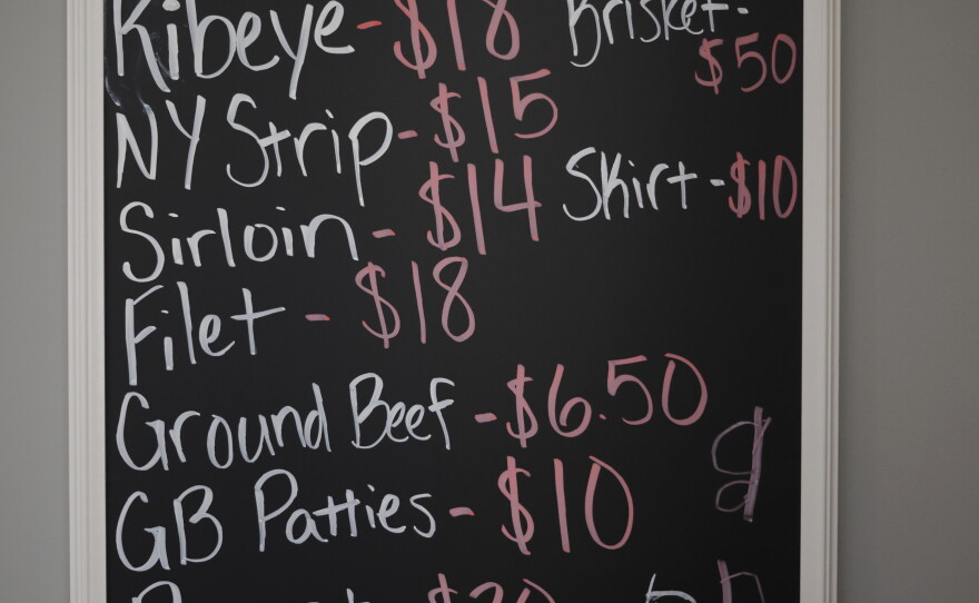 A Hallstead Farms price list is displayed at the farm.