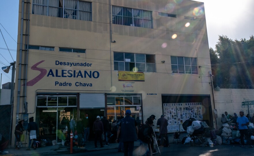 Hundreds of migrants and homeless people line up for breakfast at the Desayunador Salesiano Padre Chava shelter in Tijuana, October 26, 2022.<br/>