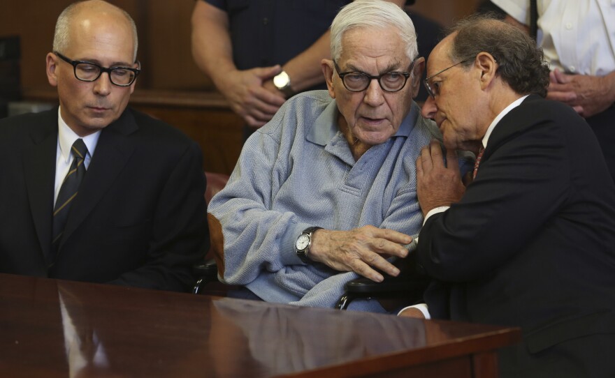 Anthony Marshall speaks to his attorney in criminal court in 2013 in New York. He surrendered to begin his prison term after years of fighting his conviction of defrauding his mother socialite Brooke Astor.