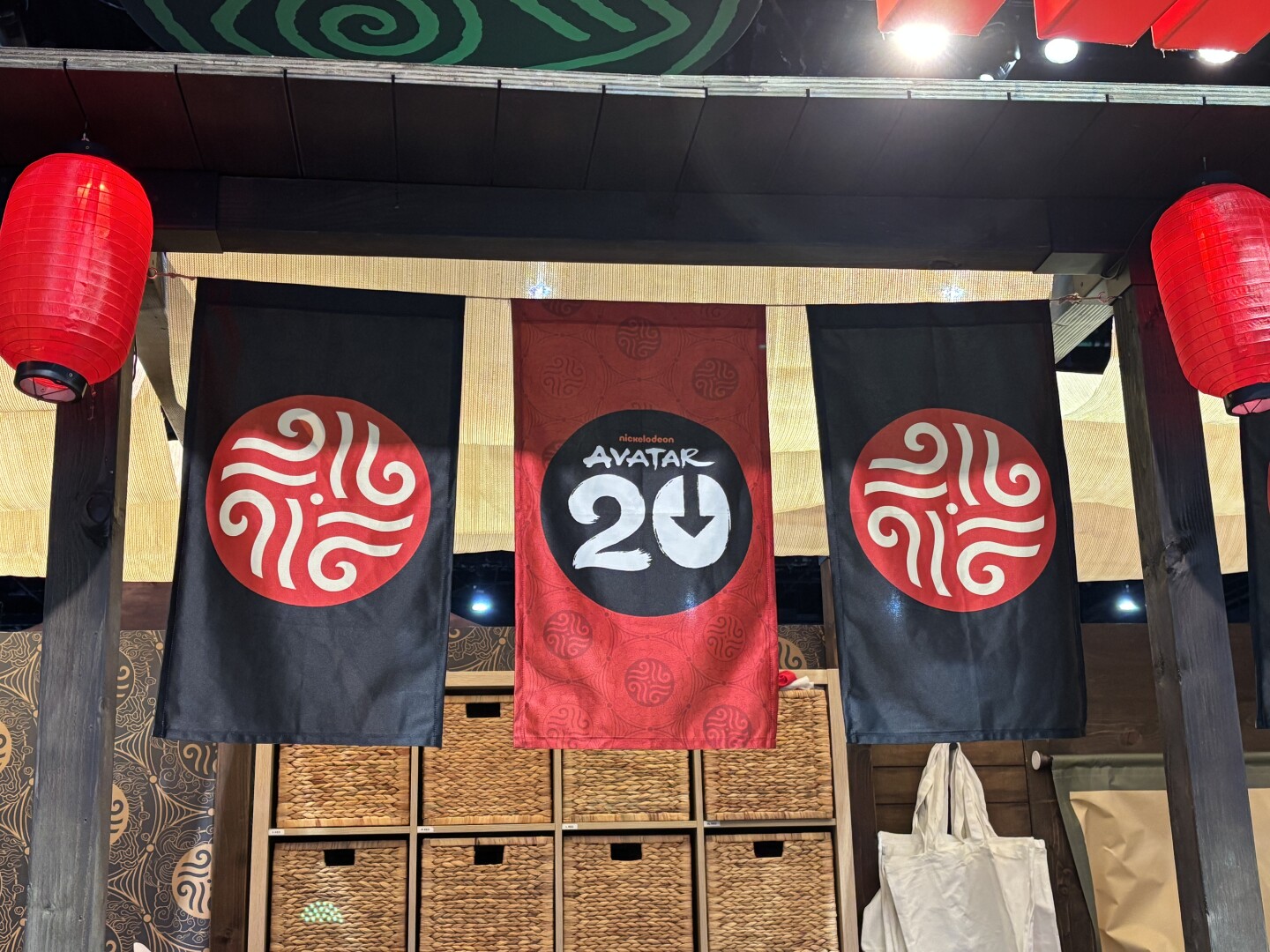 Banners hanging from the booth signify the 20th anniversary of the show. Photo taken July 24, 2025.