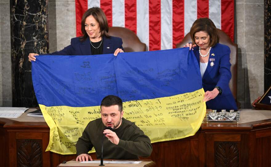 Ukrainian President Volodymyr Zelenskyy speaks after giving a Ukrainian national flag to House Speaker Nancy Pelosi, D-Calif., and Vice President Harris during his address to Congress on Dec. 21.