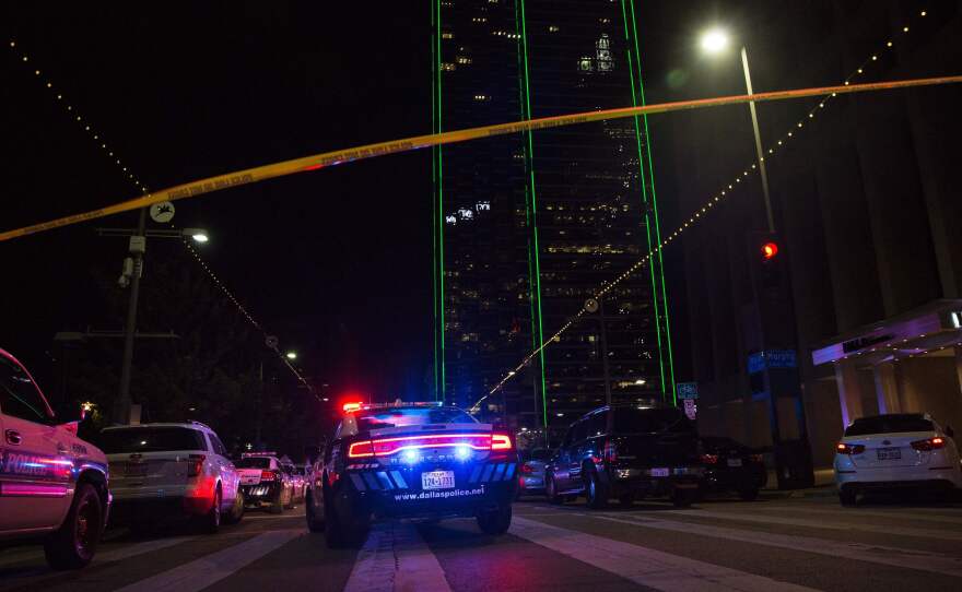 Police cars sit on Main Street in Dallas following the shooting during a protest on Thursday. Five law enforcement officers were killed in the course of the attack.