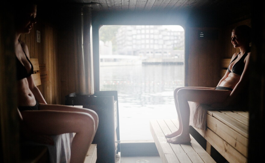 Sanna Bendiksen Landhaug (left) and Ida Hellum Reppen take an early morning sauna at Sukkerbiten in Oslo, Norway. Sukkerbiten is the Oslo Sauna Association's cluster of many small saunas in a variety of styles, lined up along a pier.
