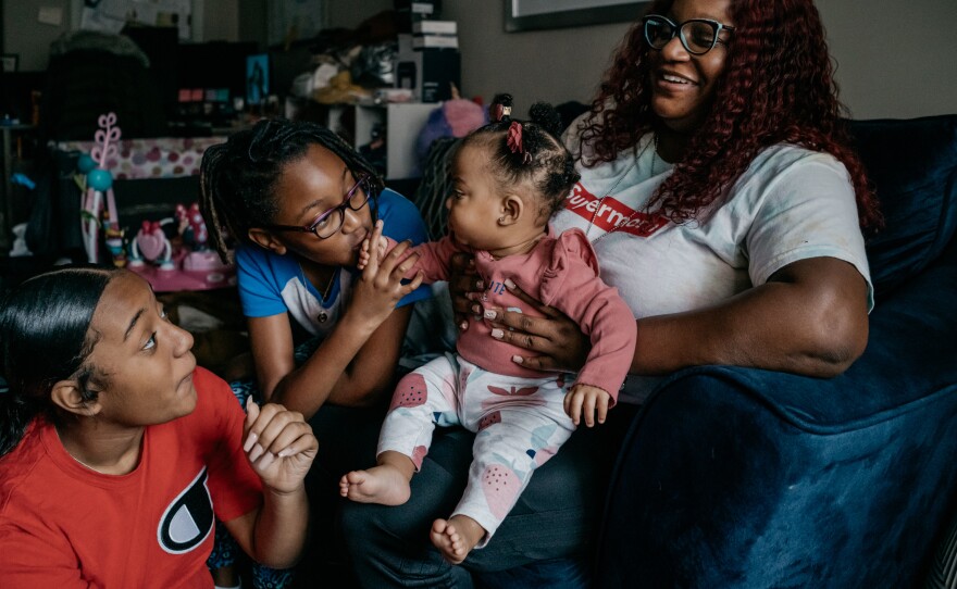Cassie Washington at home with her three daughters, Cali, Cayden and Chloe. After fleeing her marriage in 2015, Washington and her older children started attending therapy sessions to work through their experience together.