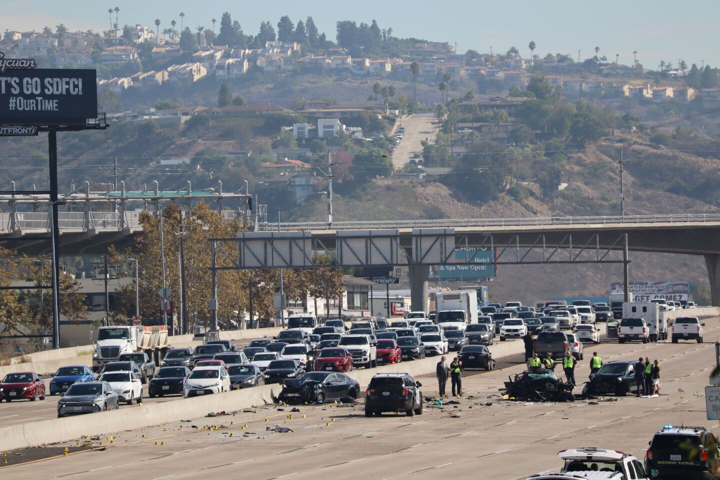 Officers surround a collision on Interstate 8 where a police officer was struck and announced dead at the scene in La Mesa on Oct. 21, 2025.