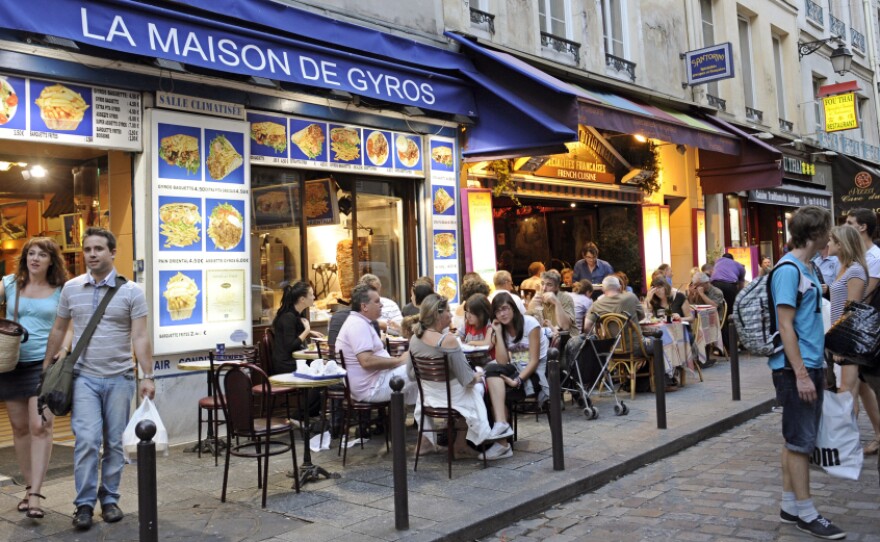 Restaurants line a street of the Quartier Latin in central Paris.