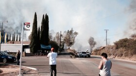 Smoke from a El Cajon trailer park is seen, May 14, 2014.